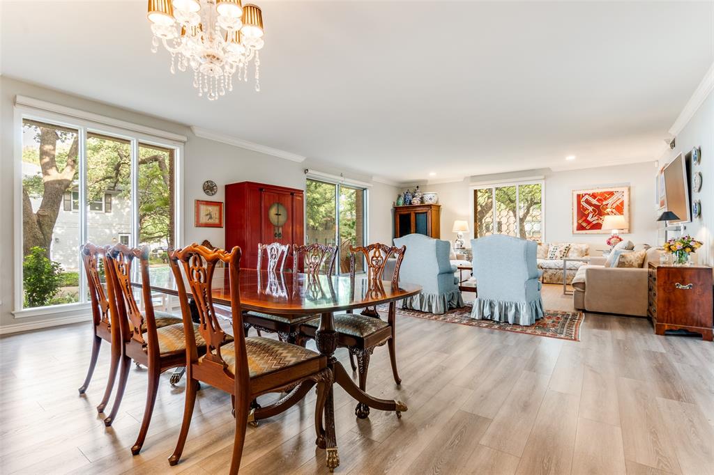 6306 Bandera Avenue, Unit B Dallas, TX 75225 - Photo 6 of 14 Open-concept living area featuring wood-finish flooring, a crystal chandelier, recessed lighting, and large windows with abundant natural light