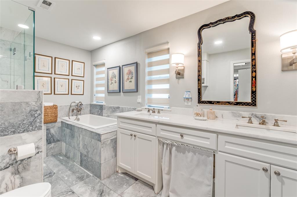 6306 Bandera Avenue, Unit B Dallas, TX 75225 - Photo 10 of 14 Bathroom featuring dual vanities with white cabinetry, white countertops, and wall-mounted sconces