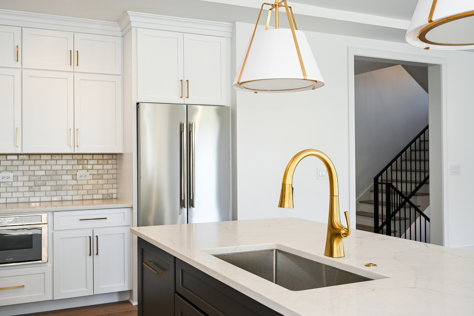 62 Miller Road Lake Zurich, IL 60047 - Photo 15 of 48 a kitchen with a refrigerator sink and cabinets