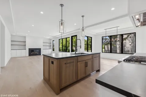 a kitchen with stainless steel appliances a stove sink and cabinets