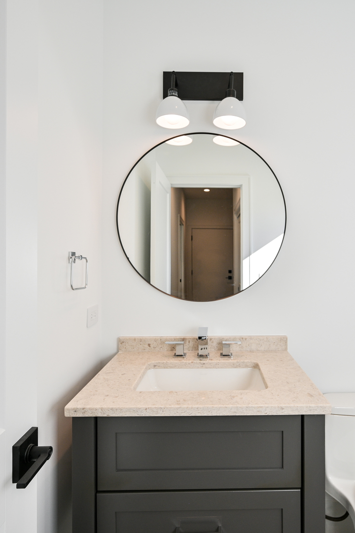 62 Miller Road Lake Zurich, IL 60047 - Photo 23 of 48 a bathroom with a sink and a mirror