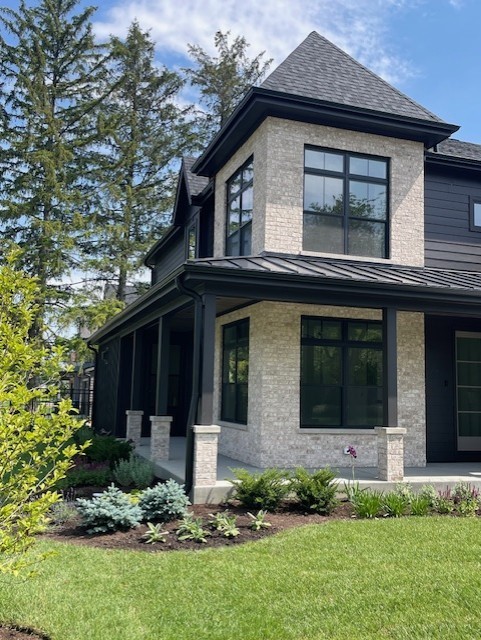 62 Miller Road Lake Zurich, IL 60047 - Photo 9 of 48 a front view of a house with a yard and garage