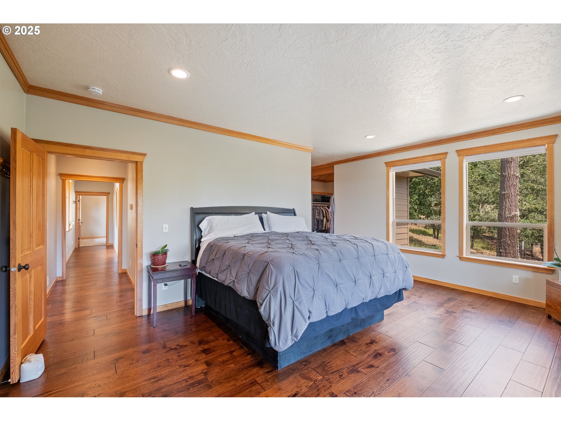 24911 Gap Road Brownsville, OR 97327 - Photo 14 of 44 a bedroom with a large bed and a large window