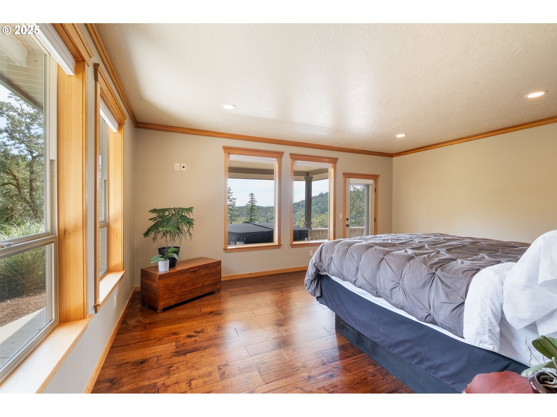 24911 Gap Road Brownsville, OR 97327 - Photo 15 of 44 a spacious bedroom with a large bed and a large window
