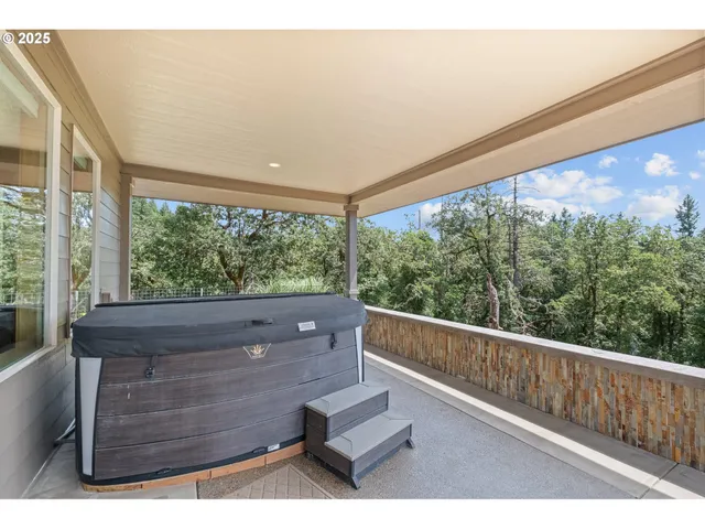 a view of room with window and wooden floor