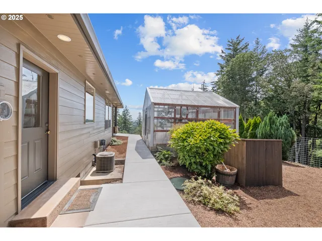 a view of a porch with furniture and a yard