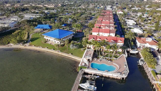 an aerial view of a house with outdoor space