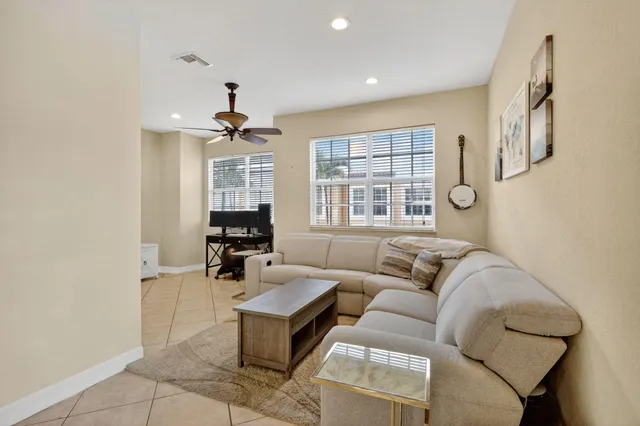 a living room with furniture and window