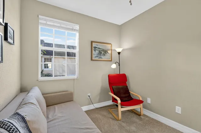 a view of a livingroom with furniture and staircase