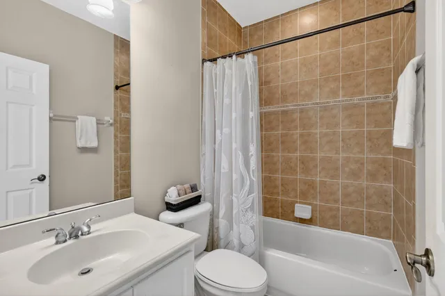 a spacious bedroom with a bed and a window