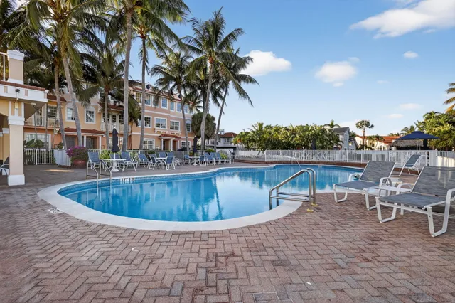 a view of a balcony with chairs