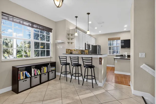 a living room with furniture and a book shelf
