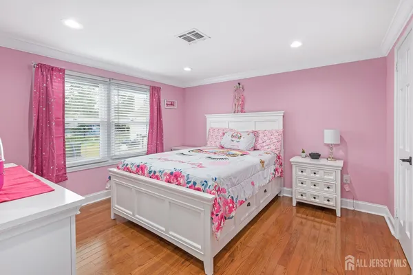 a bed room with a bed and a window