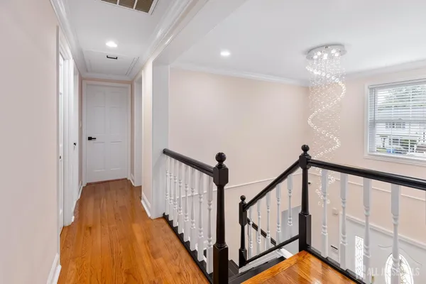 a view of a hallway with windows