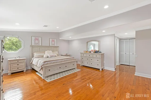 a spacious bedroom with a bed and a couch