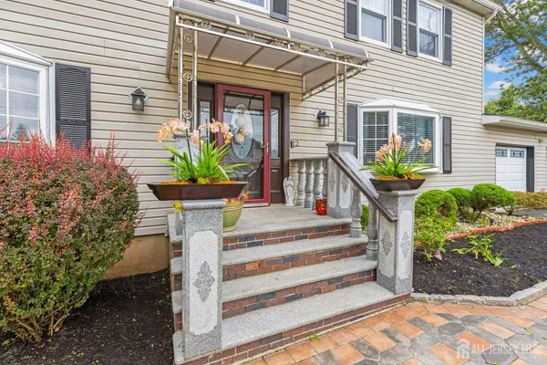a view of a house with potted plants