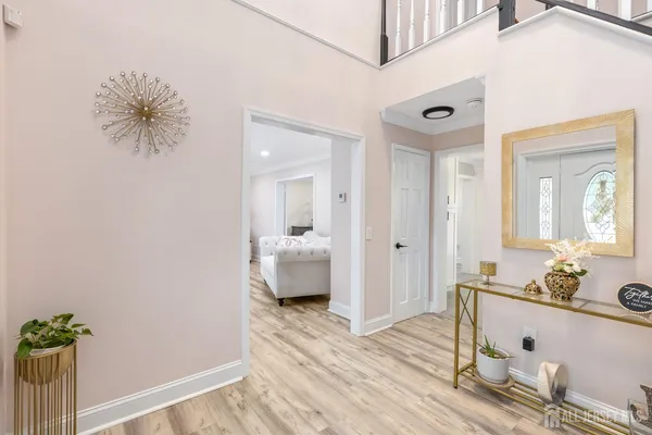 a spacious bathroom with a granite countertop sink and a mirror