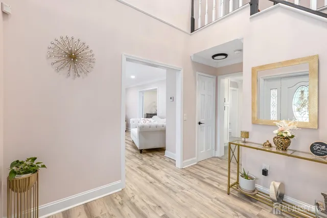 a spacious bathroom with a granite countertop sink and a mirror
