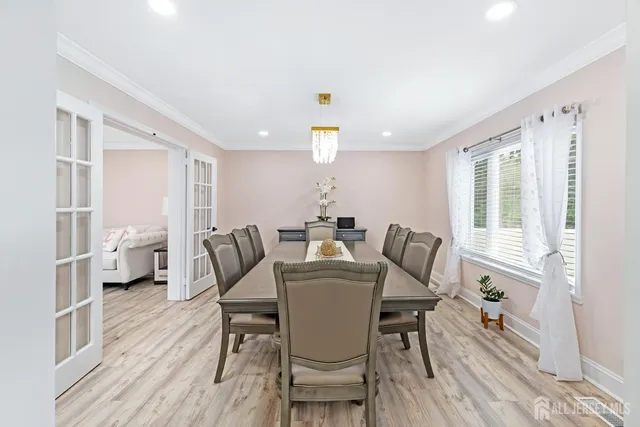 a dining room with furniture and wooden floor