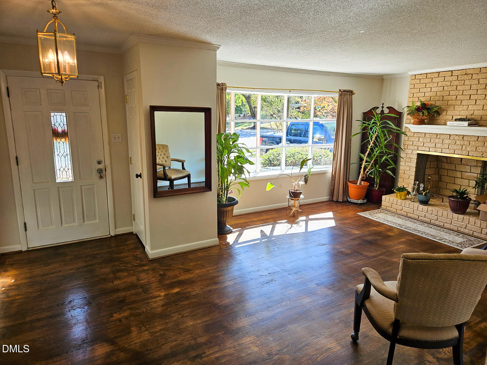 2212 Sanderford Road Raleigh, NC 27610 - Photo 11 of 28 a living room with furniture and a chandelier