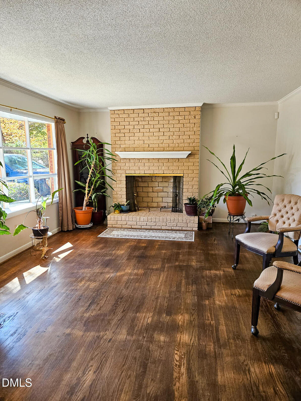 2212 Sanderford Road Raleigh, NC 27610 - Photo 12 of 28 a living room with furniture a window and a fireplace