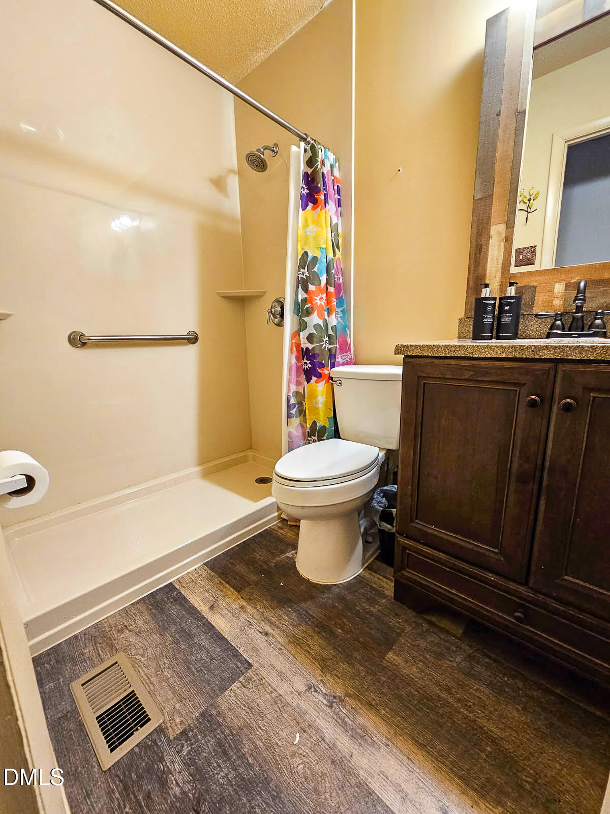 2212 Sanderford Road Raleigh, NC 27610 - Photo 17 of 28 a bathroom with a toilet a sink and a shower