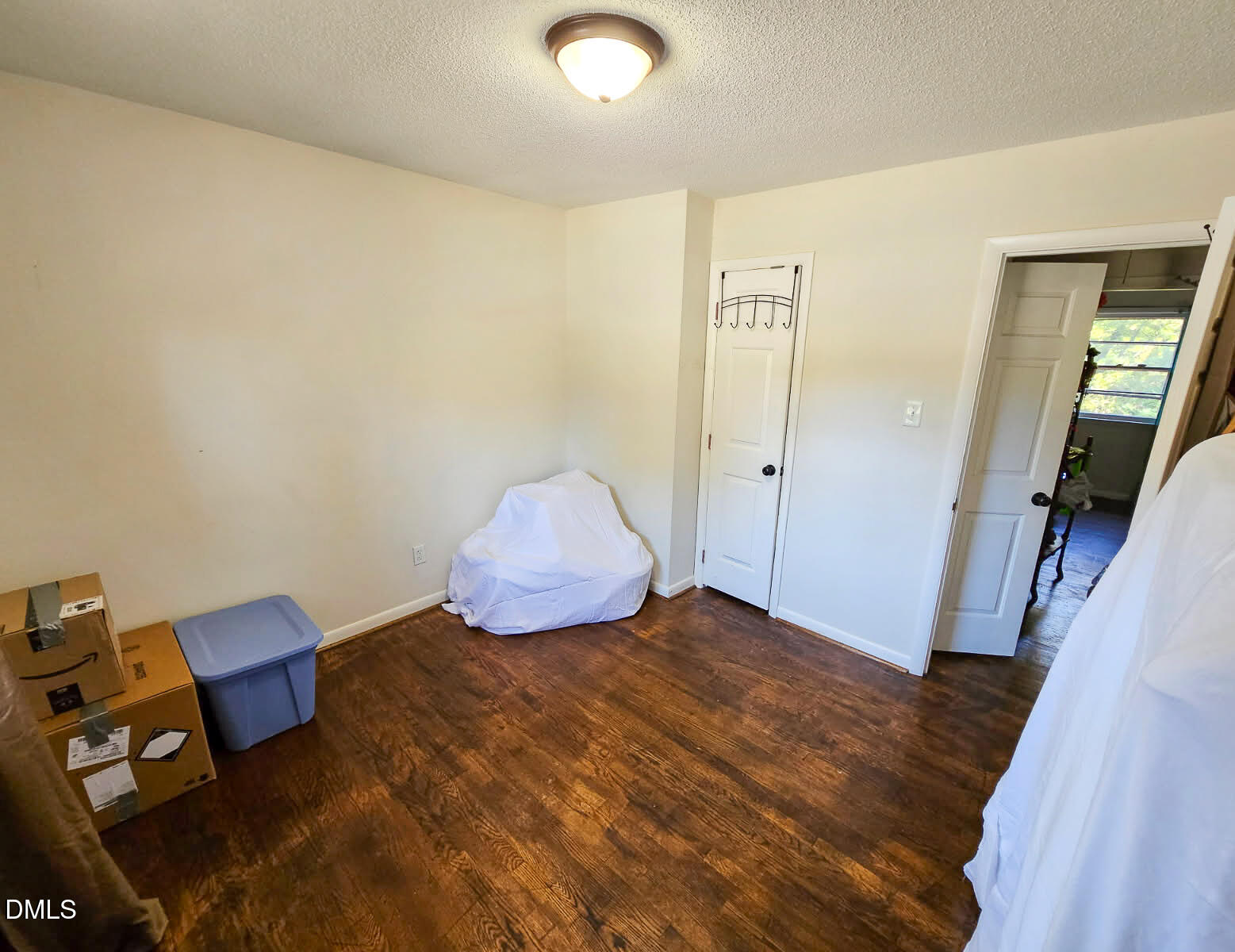 2212 Sanderford Road Raleigh, NC 27610 - Photo 18 of 28 a view of a room with wooden floor