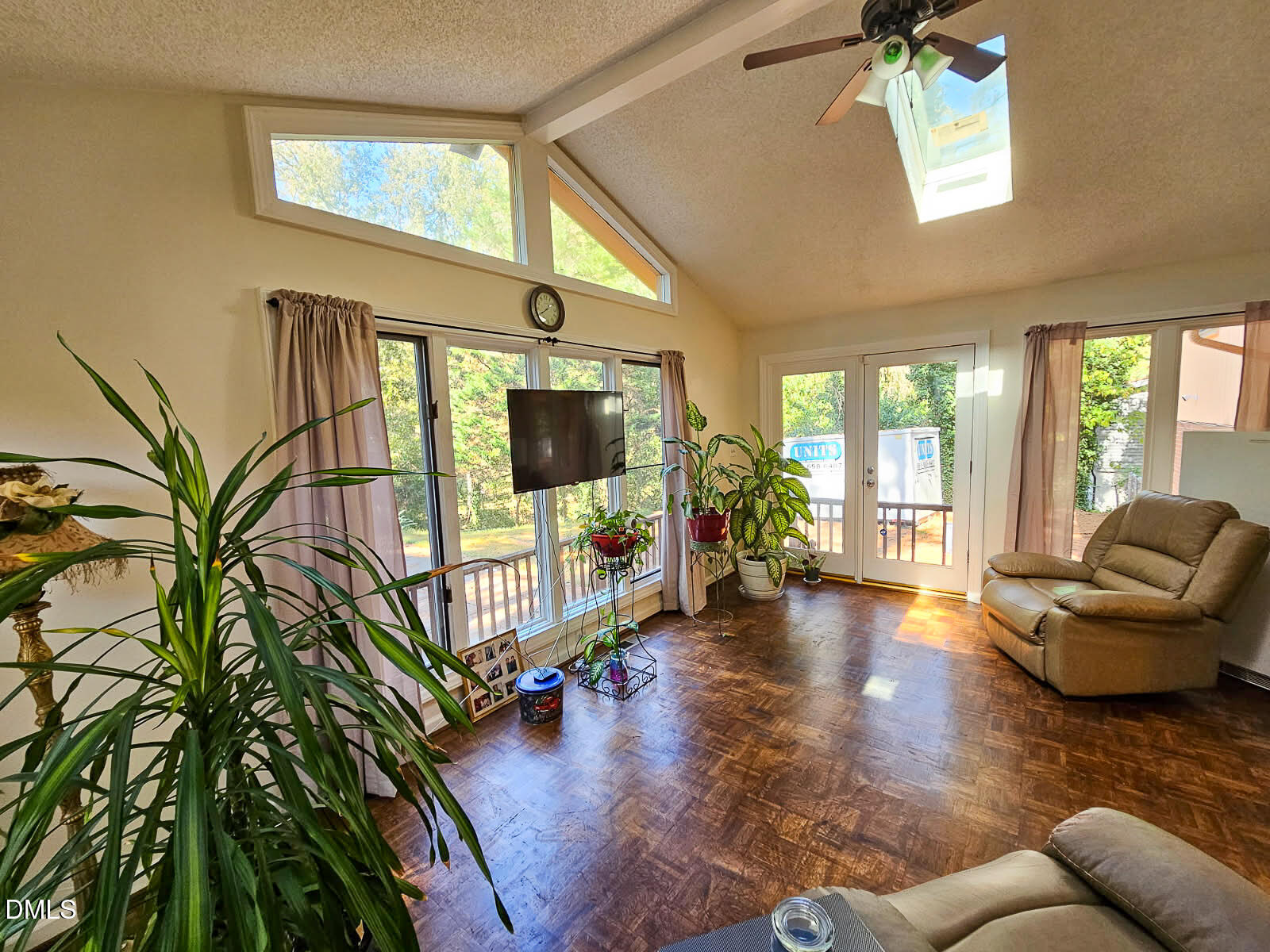 2212 Sanderford Road Raleigh, NC 27610 - Photo 27 of 28 a living room with furniture and a flat screen tv