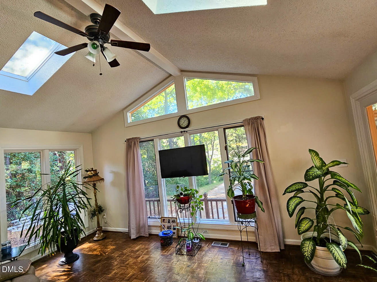 2212 Sanderford Road Raleigh, NC 27610 - Photo 28 of 28 a living room with furniture and a flat screen tv