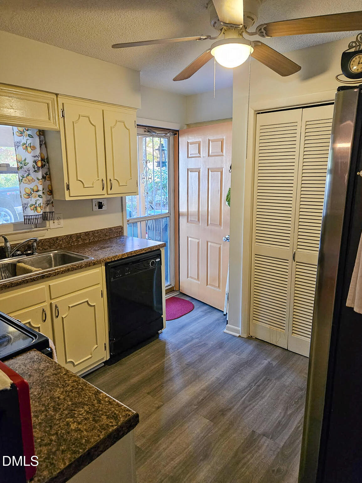 2212 Sanderford Road Raleigh, NC 27610 - Photo 5 of 28 a kitchen with stainless steel appliances granite countertop a sink and cabinets