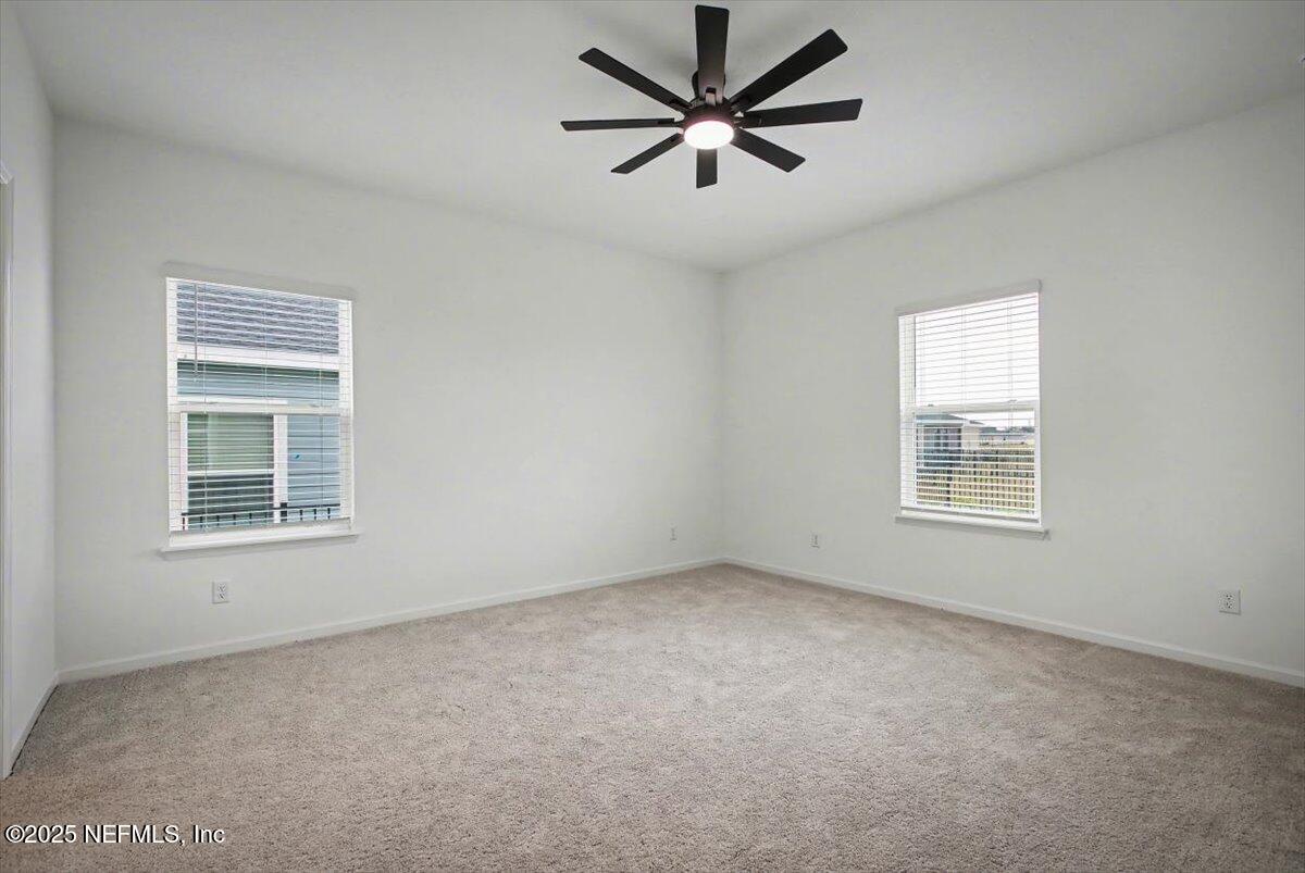 2692 Field Daisy Ln Green Cove Springs Green Cove Springs, FL 32043 - Photo 18 of 37 an empty room with a window and a fan