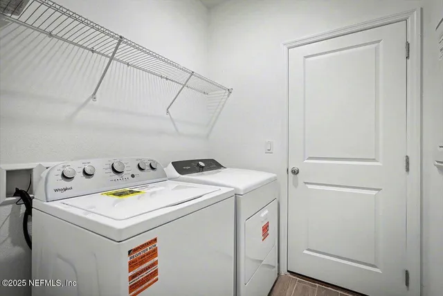a utility room with dryer and washer