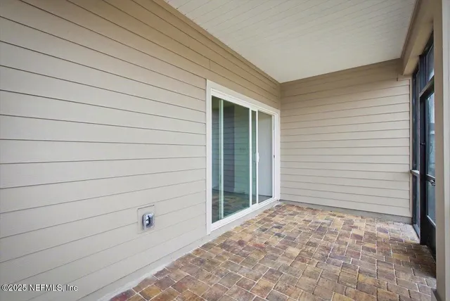 a view of a door and a window