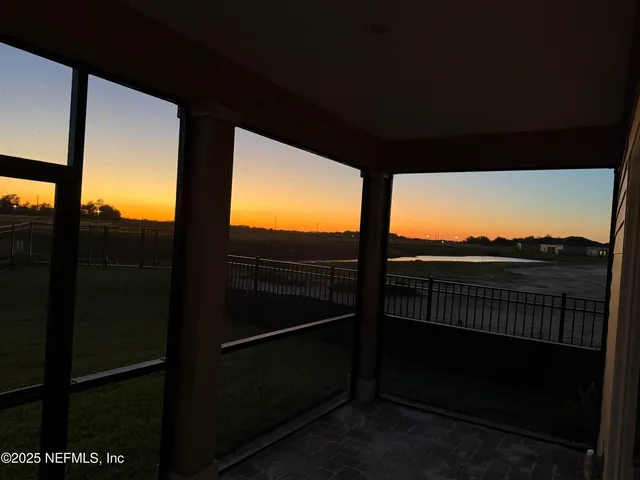 a view of a balcony with furniture
