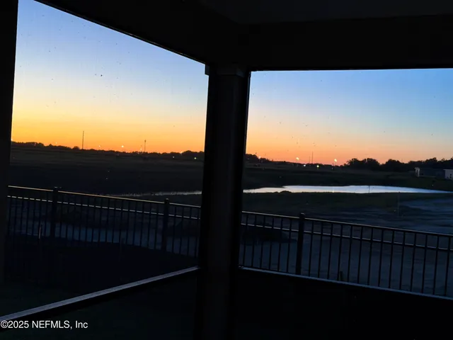 a view of balcony with furniture