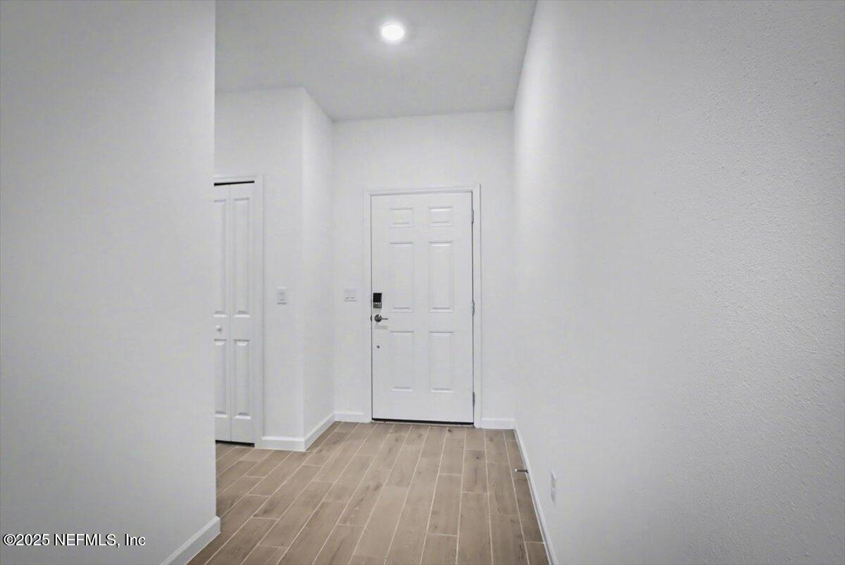 2692 Field Daisy Ln Green Cove Springs Green Cove Springs, FL 32043 - Photo 4 of 37 a view of a hallway with wooden floor