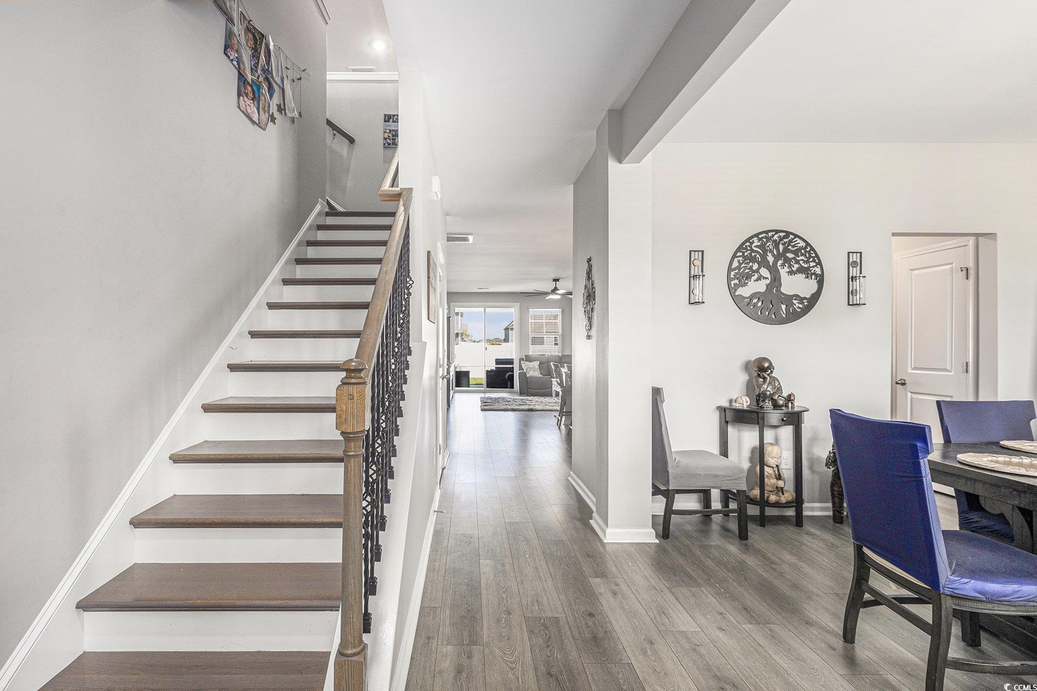 312 Cattle Drive Circle Myrtle Beach, SC 29588 - Photo 13 of 34 Dining area featuring a chandelier and wood finished floors