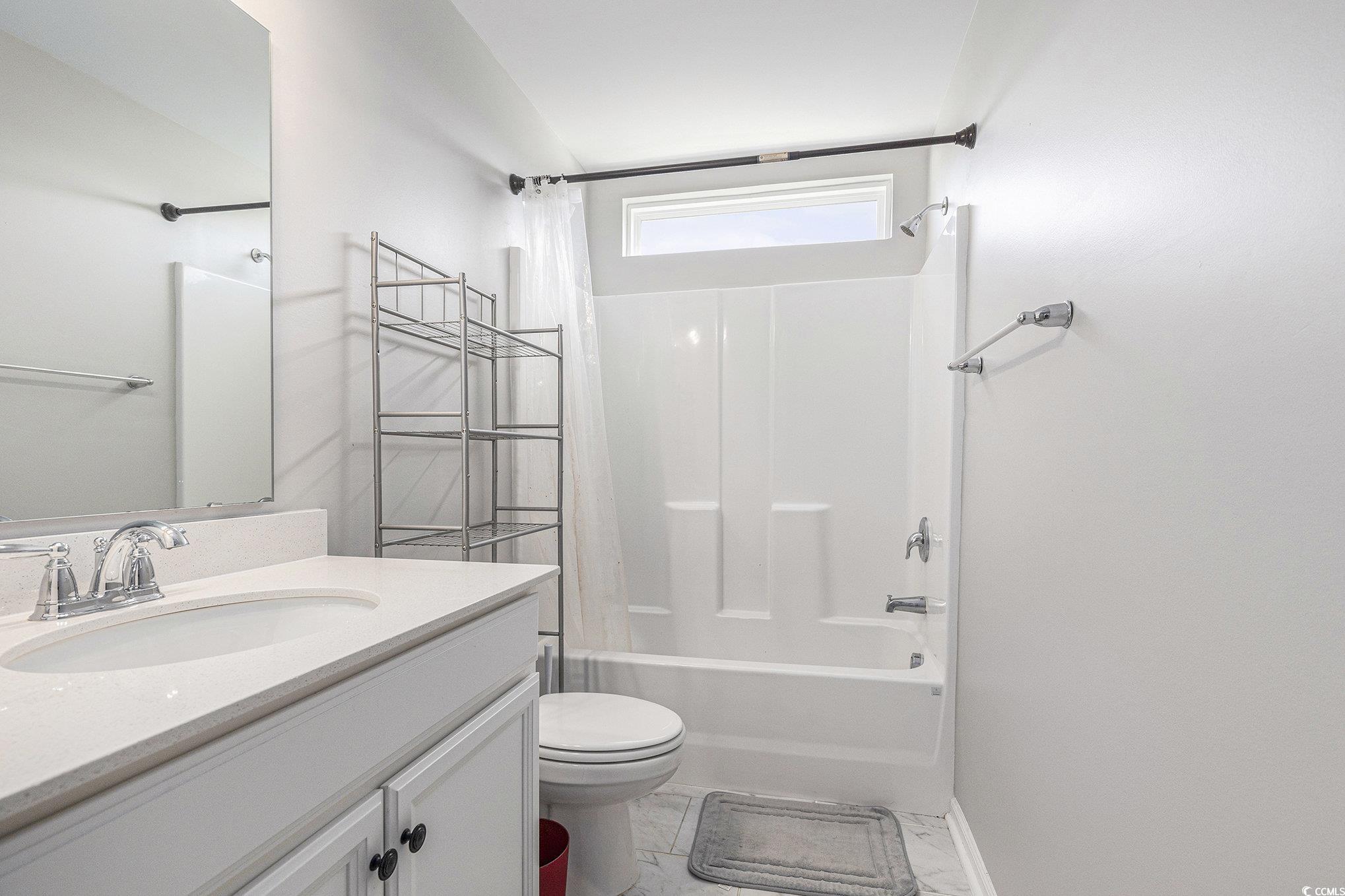 312 Cattle Drive Circle Myrtle Beach, SC 29588 - Photo 22 of 34 Bedroom featuring dark wood-type flooring, a closet, and a ceiling fan