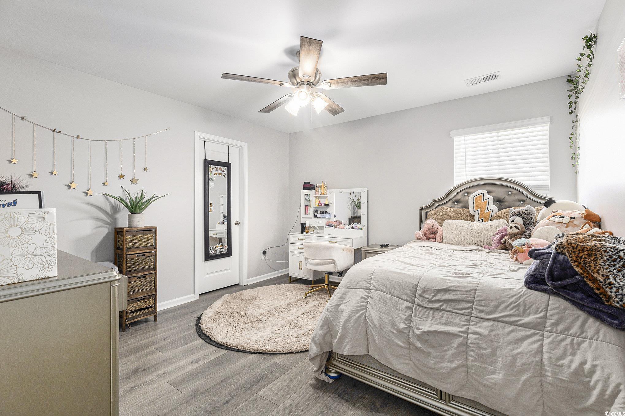 312 Cattle Drive Circle Myrtle Beach, SC 29588 - Photo 23 of 34 Bedroom with wood finished floors and a ceiling fan