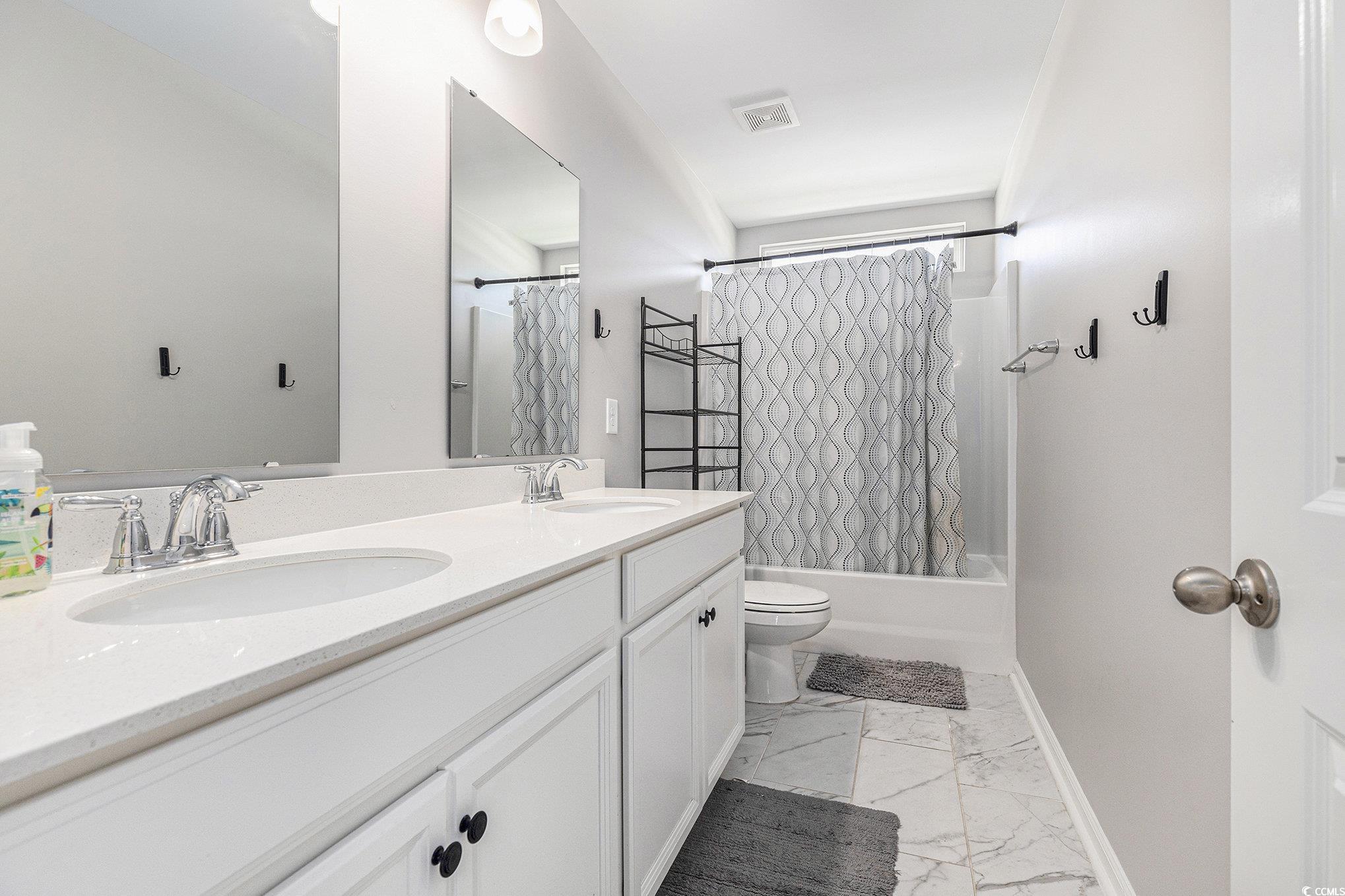 312 Cattle Drive Circle Myrtle Beach, SC 29588 - Photo 27 of 34 Bedroom with wood finished floors and a ceiling fan