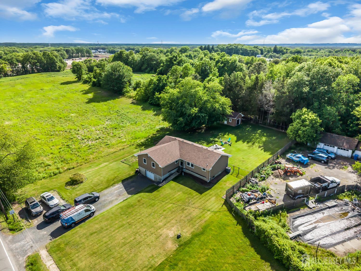 99 Schulmeister Road Old Bridge, NJ 08857 - Photo 47 of 49 an aerial view of a house with a garden and lake view