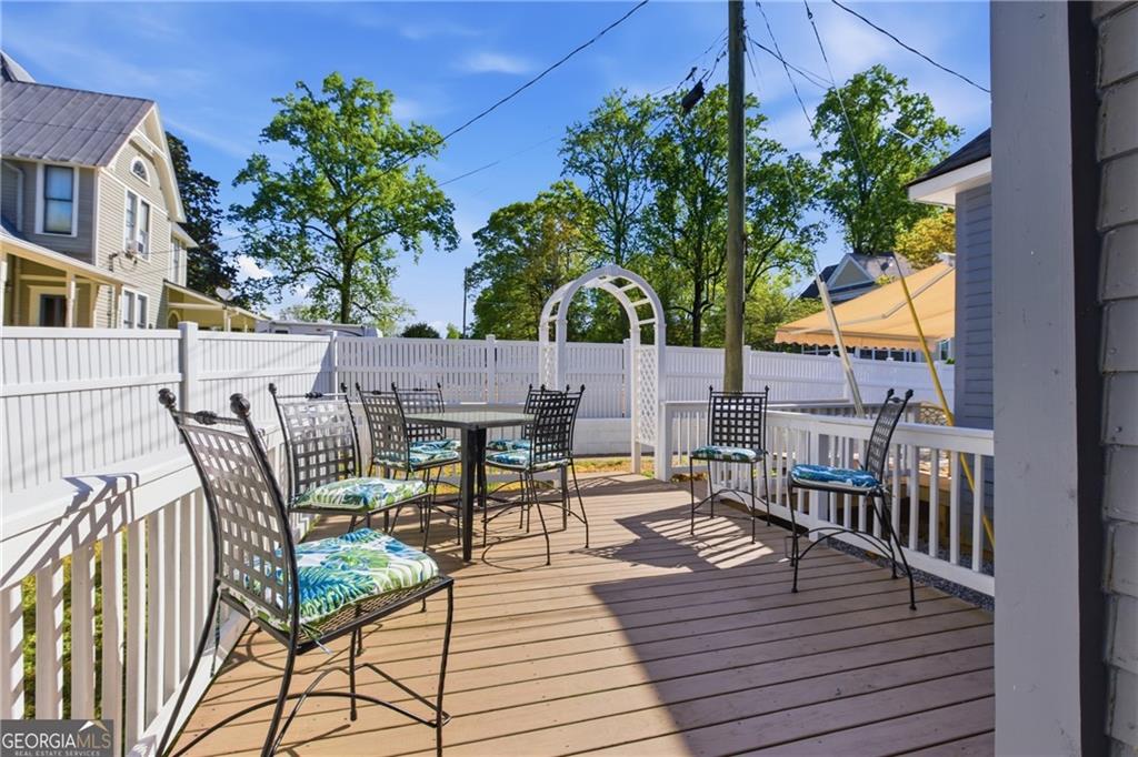 1910 Hancock Road Demorest, GA 30535 - Photo 22 of 29 a view of a chairs and table on the wooden deck