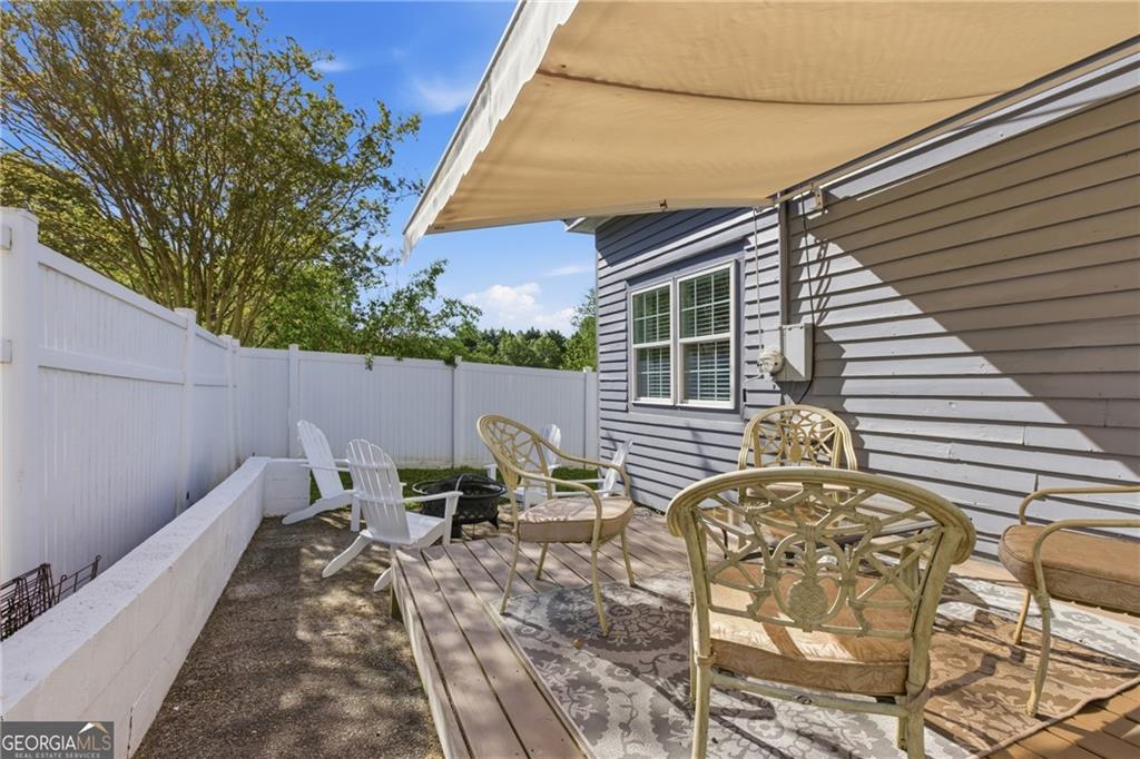 1910 Hancock Road Demorest, GA 30535 - Photo 23 of 29 a backyard of a house with table and chairs