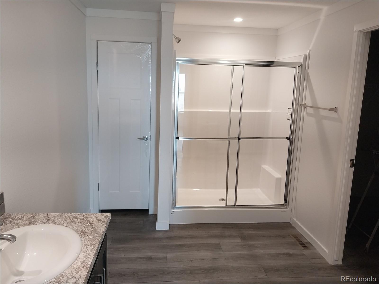 776 North Ramah Highway Yoder, CO 80864 - Photo 14 of 18 a bathroom with a granite countertop sink and a mirror