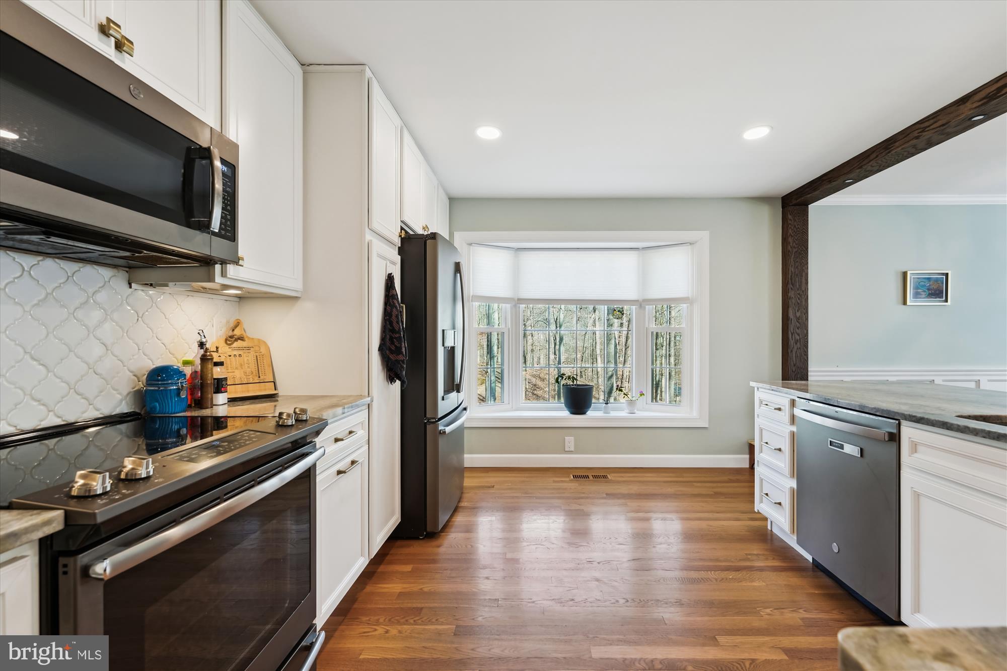 5404 Well Spring Road La Plata, MD 20646 - Photo 14 of 34 a kitchen with stainless steel appliances a stove a sink and a refrigerator