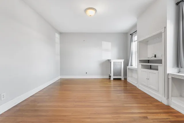 a view of kitchen with furniture and wooden floor