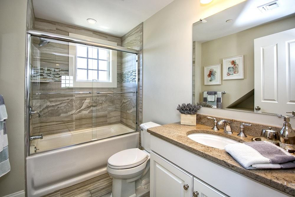 12 Coastline Drive Mashpee, MA 02649 - Photo 23 of 46 a bathroom with a granite countertop sink toilet and shower