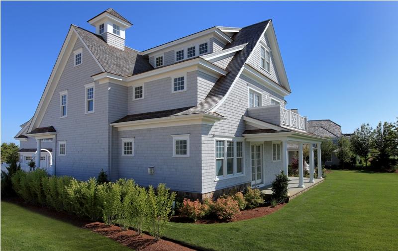 12 Coastline Drive Mashpee, MA 02649 - Photo 26 of 46 a front view of a house with a garden