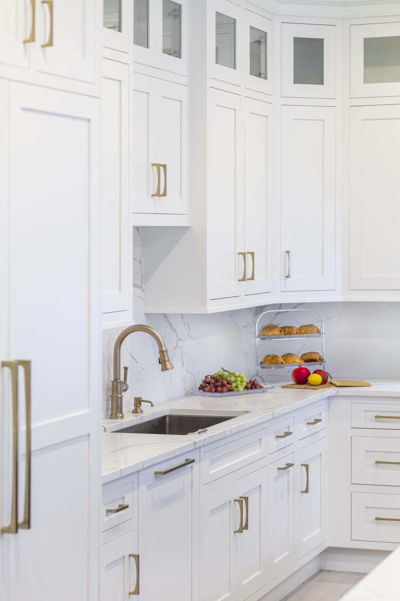 12 Coastline Drive Mashpee, MA 02649 - Photo 8 of 46 a kitchen with white cabinets and sink