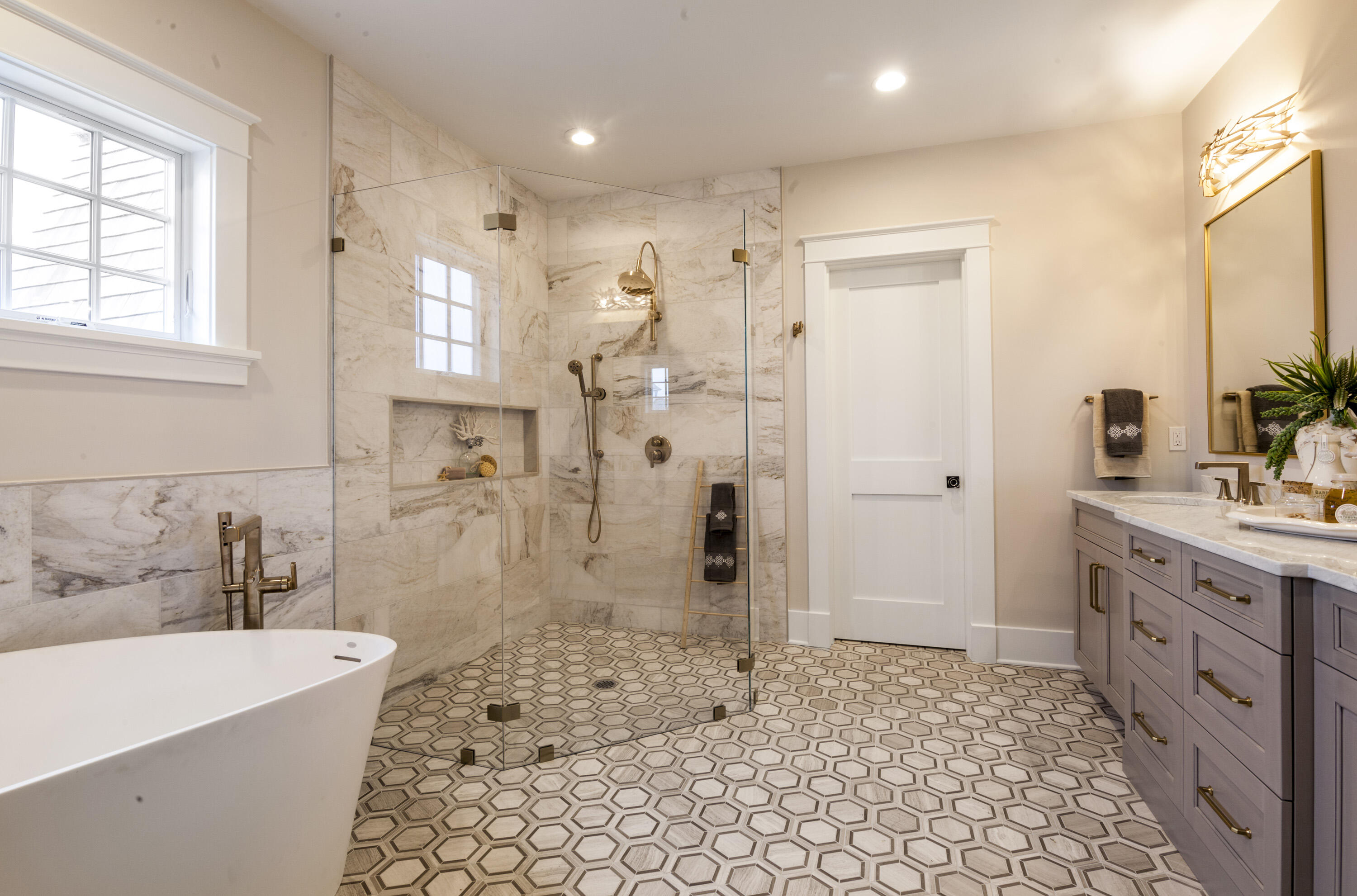 12 Coastline Drive Mashpee, MA 02649 - Photo 9 of 46 a bathroom with a bathtub sink and toilet